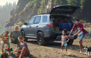 A family playing near a shoreline next to their 2024 Honda Pilot, near Orangeburg, SC