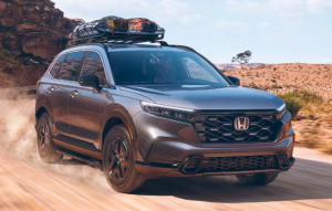 A gray 2024 Honda CR-V Hybrid driving down a dirt road near Orangeburg, South Carolina