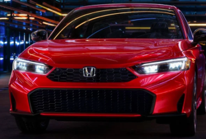 A red 2025 Honda Civic parked outdoors at nighttime near Orangeburg, South Carolina