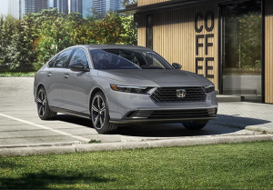 A silver 2024 Honda Accord Hybrid parked outside a coffee shop near Orangeburg, South Carolina