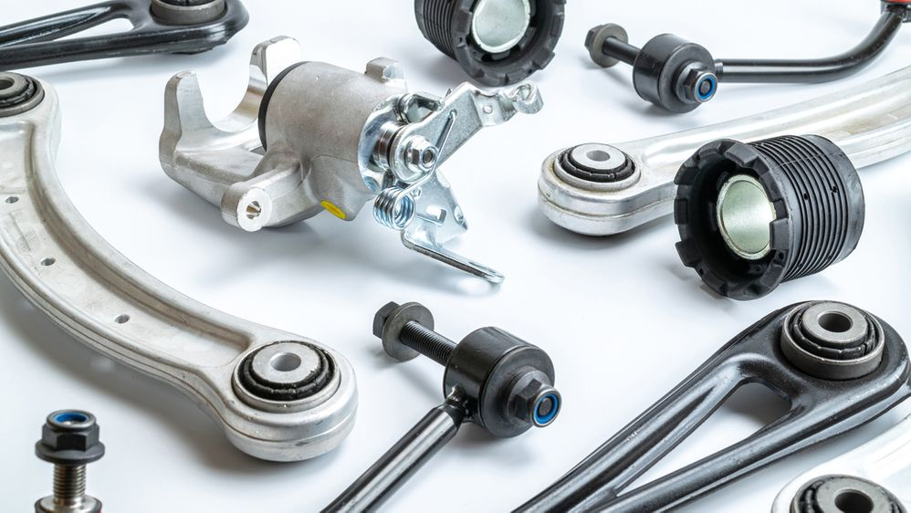 An assortment of car parts placed on a white background near Orangeburg, South Carolina