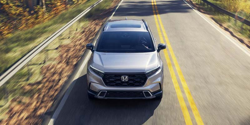 A 2026 Honda CR-V driving down a two lane road near Orangeburg, SC